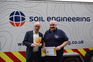 Mark Rhodes receives the Plant Yard's Green is Great Label from Christophe Dauchy